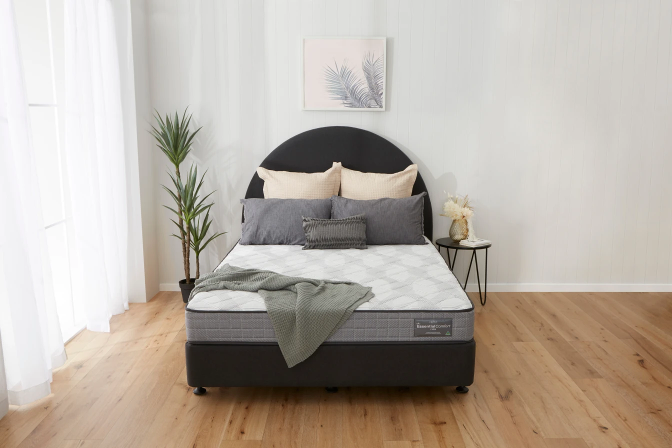 Essential Comfort firm mattress on a Boston base in a bedroom