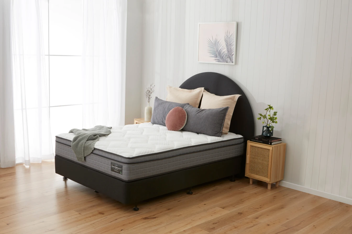 Essential Support medium mattress on a Boston base in a bedroom